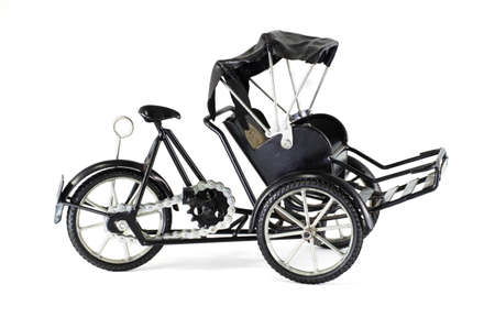 Thailand auto rickshaw three-wheeler tuk-tuk taxi driver on white backgroundの写真素材