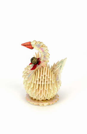 White swan.figure of bird.origami from a paper on a white backgroundの写真素材