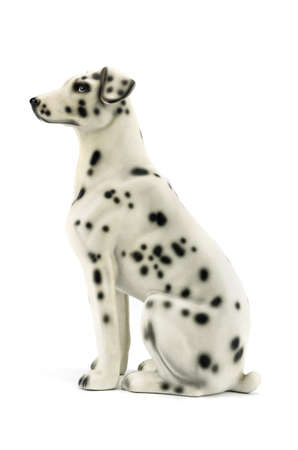 Statuette of dog isolated on white background with clipping pathの写真素材