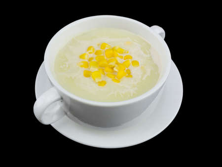 Corn cream soup isolated on the black background with clipping pathの写真素材