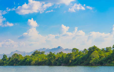Summer landscape with forest lake and blue sky ,with clouds on the sky