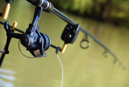 Fishing rod sitting on an alarmed podの写真素材
