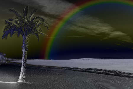 Rainbow on an inversed beach shotの写真素材