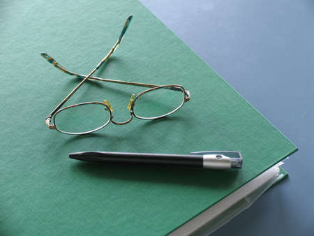 Teachers notes, glasses and pen.の写真素材
