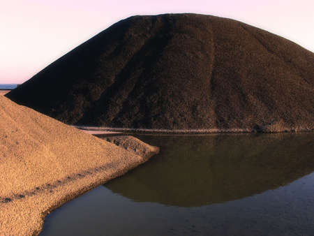 Loads of coal and stones at the quay of Nyborg, Denmarkの写真素材