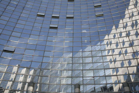Corporate glass building with open windows - La Defense, Paris.