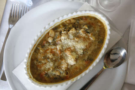 Italian vegetables soup with beans, bread and parmesan cheese. Very delicious!の写真素材