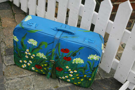 Old home decorated suitcase.... "to live is to travel"... Ready for departure.の写真素材