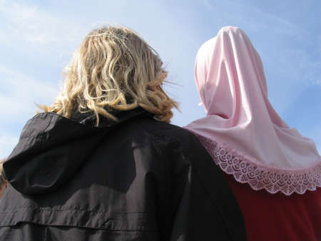 Two danish teenagers with different cultural backgrounds living friendly together.の写真素材