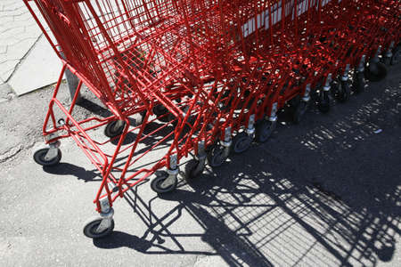 Parked shopping carts in front of a store.