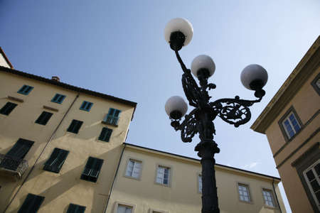 Beautiful old lamp and condos - Lucca, Italy.の写真素材