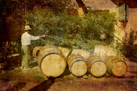 Artistic work of my own in retro style - Postcard from Italy. - Farmer preparing new wine barrels - Piedmontの写真素材