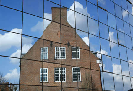 Old hospital buildings reflect in a new modern part - Odense, Denmark. の写真素材