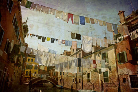 Artistic work of my own in retro style - Postcard from Italy. - Clotheslines above a canal - Venice.の写真素材