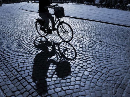  A warm spring afternoon a young girl is biking through the old streets of Copenhagen, Denmark.                      の写真素材