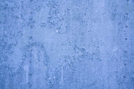 Blue grunge background with peeling paint.の写真素材