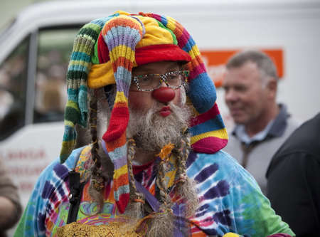 SVENDBORG, DK - MAY 22:  Stocking clown performing in the street during 12th International Clown Festival   May 22, 2010 Svendborg, Denmark.のeditorial素材