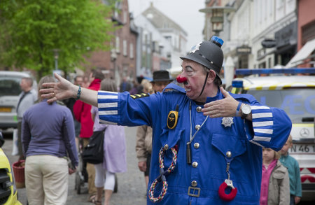 SVENDBORG, DK - MAY 22:  Clown  P C Bluey performing in the street during 12th International Clown Festival   May 22, 2010 Svendborg, Denmark.のeditorial素材