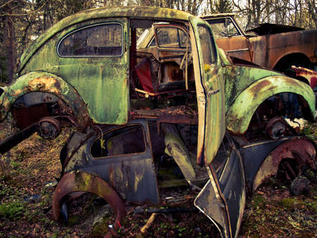 Heap of old cars left in the nature near the Norwegian border - Sweden.  From the series scrap in...