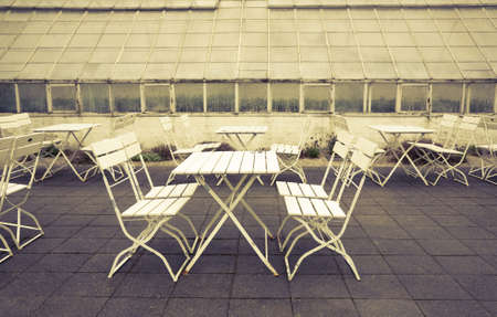 Old greenhouse and garden furniture Sofiero, Sweden. Cross processed to underline the retro look.の写真素材