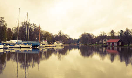 Tranquil scenery from the Gota Canal Sweden. Cross processed to give a retro look. Space for text.の写真素材