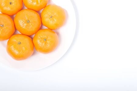 Orange on the white dishの写真素材