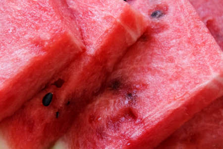 Juicy big red watermelon lying on a woodenの写真素材