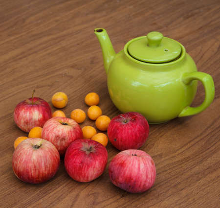 Green tea on the table with applesの写真素材