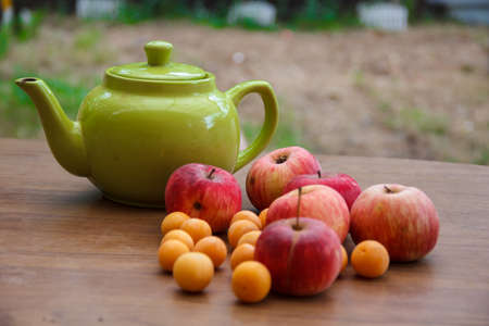 Green tea on the table with applesの写真素材