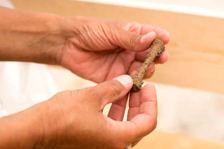2017.07.07, Trieste, Italy. Archaeologist shows a human bones