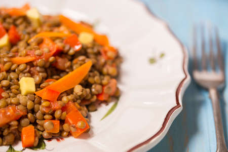 Vegetarian lentils salad with vegetables, rustic style. Close-up photoの写真素材