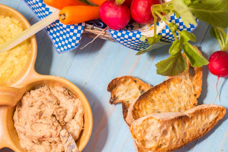 Roasted bread ciabatta and herring cream cheese. fresh vegetables on the dish. Close-up photo. Copy spaceの写真素材