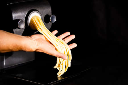 Home made tagliatelle pasta by pasta maker