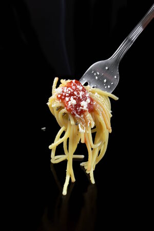 Spaghetti with tomato sauce and parmesan cheeseの写真素材