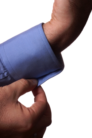 Man buttoning a cuff
