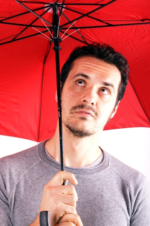 Man with red umbrellaの写真素材