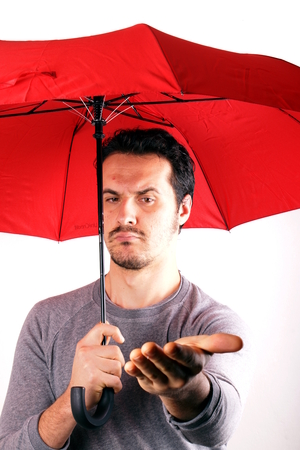 Man with red umbrellaの写真素材