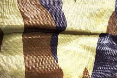 Close up of a fabric with camouflage designs