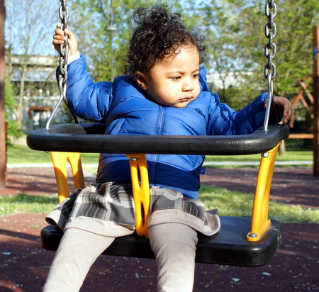Detail of playing children in a parkの写真素材