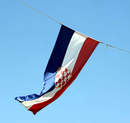 Detail of a waving croatian flag on blue backgroundの写真素材