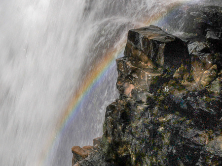 close up of a rainbow on the edge of ferguson falls on tasmania's popular overland track in cradle mountain npの写真素材