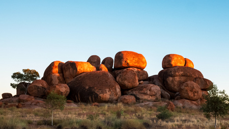 devils marbles in australias northern territory at sunriseの写真素材
