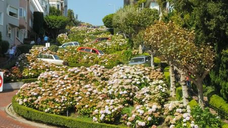 close up as cars wind their way down lombard street in san francisco