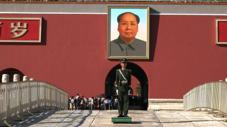 BEIJING, CHINA- OCTOBER, 2 2015: close up of the portrait of mao and a soldier at the forbidden cityのeditorial素材