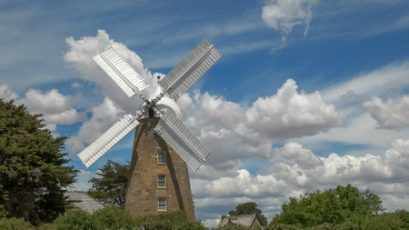 OATLANDS, TASMANIA, AUSTRALIA- DECEMBER 15, 2015: an operating windmill at oatlands with sails turningのeditorial素材