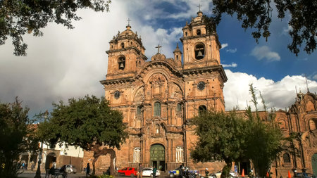 CUSCO, PERU- JUNE 20, 2016: church of the society of jesus in cusco framed by treesのeditorial素材