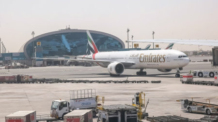 DUBAI, UNITED ARAB EMIRATES- AUGUST, 22, 2016: pushback of a boeing 777 emirates plane at dubaiのeditorial素材