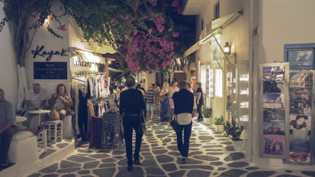 MYKONOS, GREECE- SEPTEMBER, 14, 2016: shops and tourists in the town of chora at night on mykonosのeditorial素材