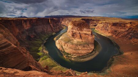 an ultra wide view of sunlit horseshoe bend at glen canyonの写真素材