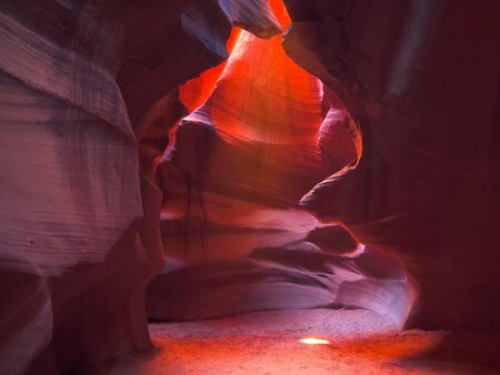 the sun shines on the floor of upper antelope canyon, arizonaの写真素材